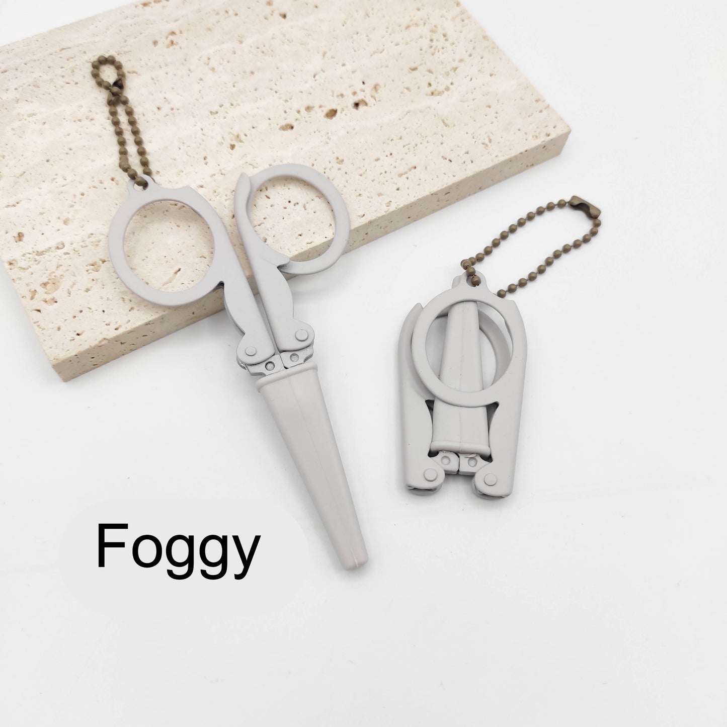 Portable folding scissors with sheath
