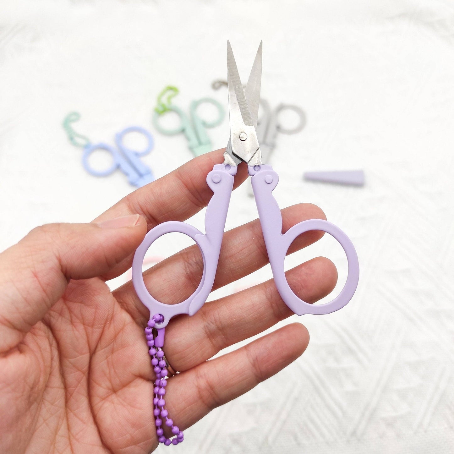 Portable folding scissors with sheath